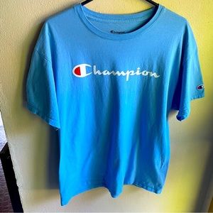 Champion Swiss Blue Script Logo Tshirt. 100% Cotton. Size Large